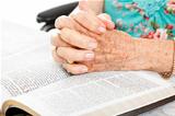 Praying Senior Hands on Bible