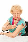 Senior Woman Gives Self Injection