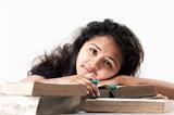 Indian Girl tired and exhausted with old books