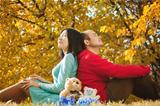 Young asian couple in love and having some autumn fun