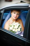 portrait of the bride in the wedding car