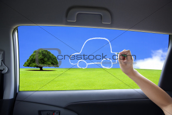 hand drawing eco green car concept on the car windows