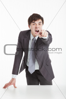 Angry businessman pointing you