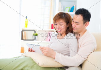 Asian couple with digital tablet computer