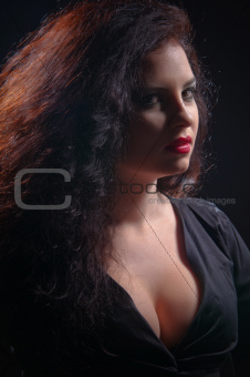 beautiful fashionable woman in black background