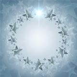 Christmas wreath of silver stars over grey background with text 