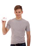 Young man holding businesscard