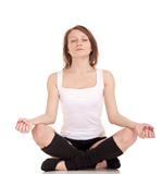 Young woman meditating in pose of lotus