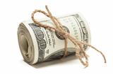 Roll of One Hundred Dollar Bills Tied in Burlap String Isolated on a White Background.