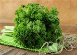 Fresh green, organic parsley on wooden table