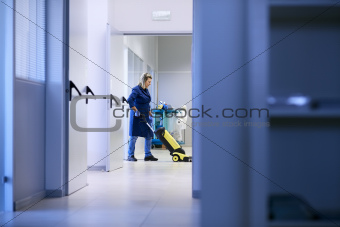 Women at workplace, professional female cleaner washing floor in