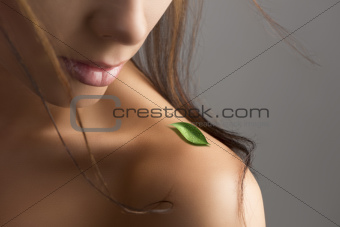 naked shoulder with leaf and flying hair