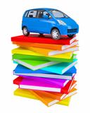 Blue family car on a stack of colorful books