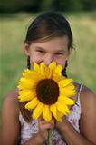 Young girl with a sunflower