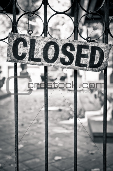 Monochrome closed sign on metal bars