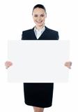 Businesswoman holding a blank white poster