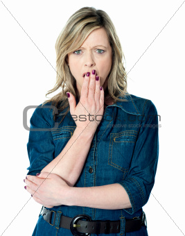 Pretty woman with hand over mouth