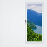white wall and window with a beautiful view on mountains and lake