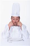 Male chef looks very unhappy