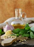 ingredients for pesto, basil, olive oil, pine nuts, garlic and parmesan