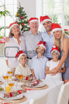 Smiling family posing for photograph at christmas