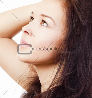 portrait of a young beautiful woman with brown hair looking