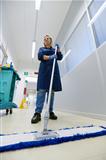 Women at workplace, professional female cleaner sweeping floor i
