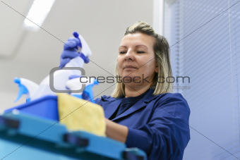 Woman working as professional cleaner in office