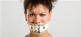 Covering mouth with a dollar banknote
