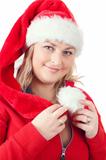 Portrait of joyful pretty woman in red santa claus hat smiling