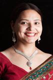 Beautiful Indian happy woman in red sari