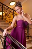 woman standing on the stairs in the hotel lobby