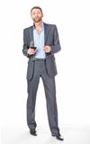 Full length portrait of cheerful business man with glass wine