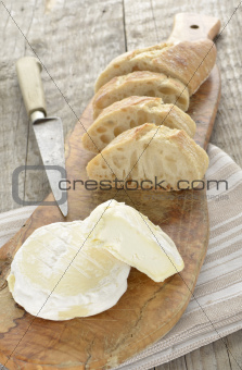 French St Marcellin soft cheese with knife