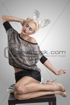 sexy girl with silver bunny ears stretches