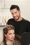 Handsome Male Hairdresser with Client