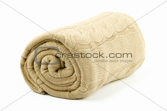 rolled beige blanket