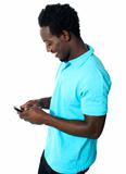 African boy busy messaging
