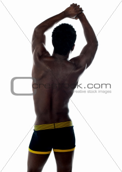Shirtless african fit guy. Back pose