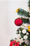 Closeup on Christmas tree with big red Christmas ball