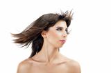 beautiful young girl with flying hair and fashion makeup on white background