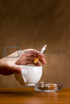 Hand holding a cigarette