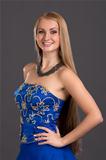 Young beautiful woman in blue dress