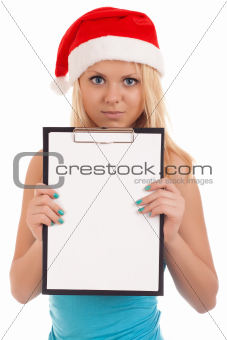 Young woman in santa hat holding blank board