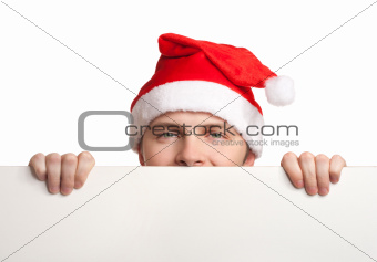 Young man in santa hat holding a blank sign
