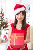 asian girl during christmas with her presents