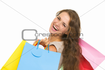 Portrait of smiling young woman with shopping bags