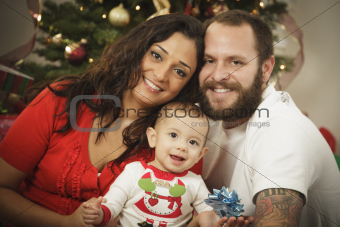 Young Mixed Race Family Portrait Near the Christmas Tree.