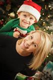 Attractive Young Mother and Baby Son Christmas Portrait.