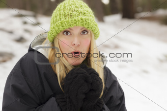 Attractive Woman Having Fun in the Snow on a Winter Day.